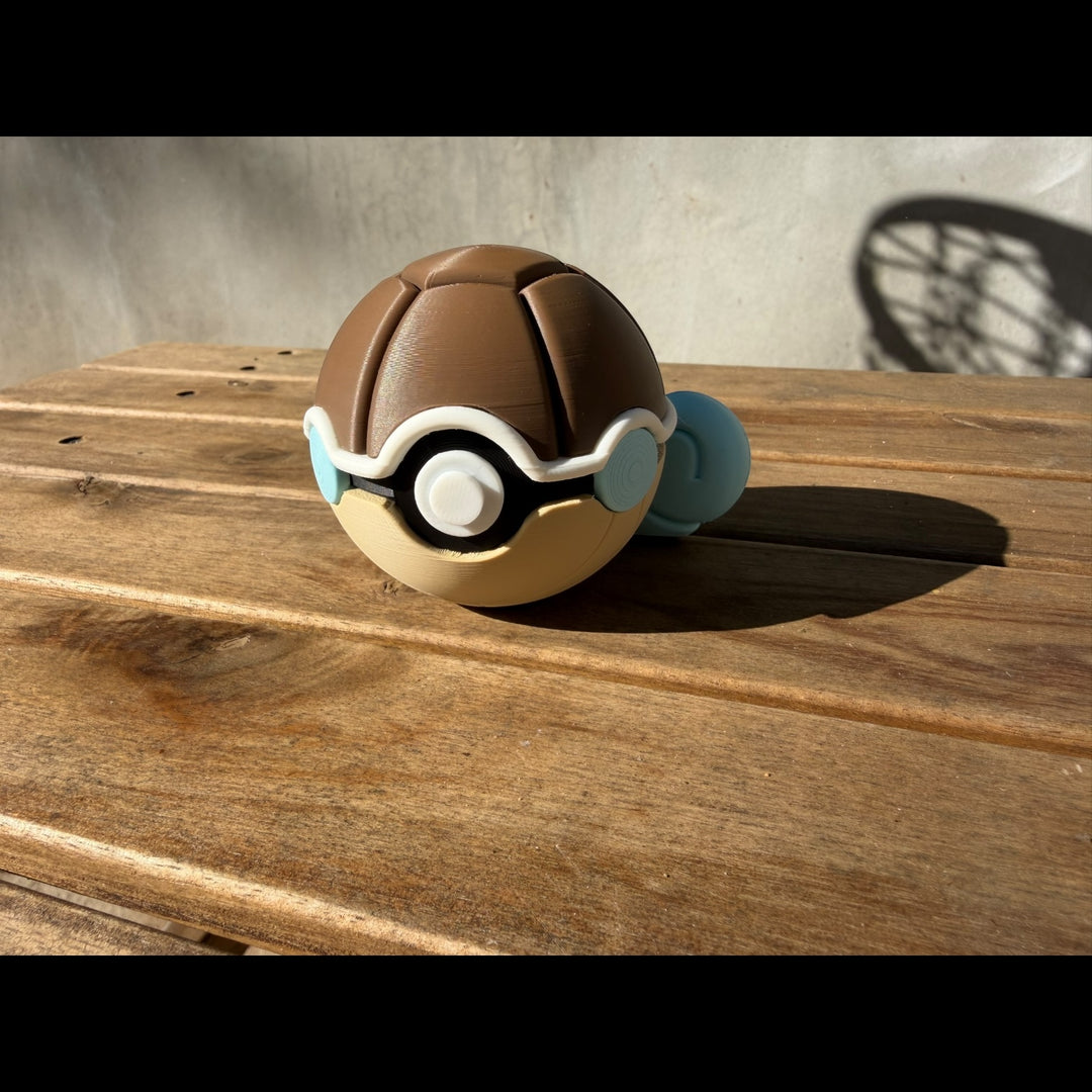 Poké Ball-like object on a wooden surface with a neutral background
