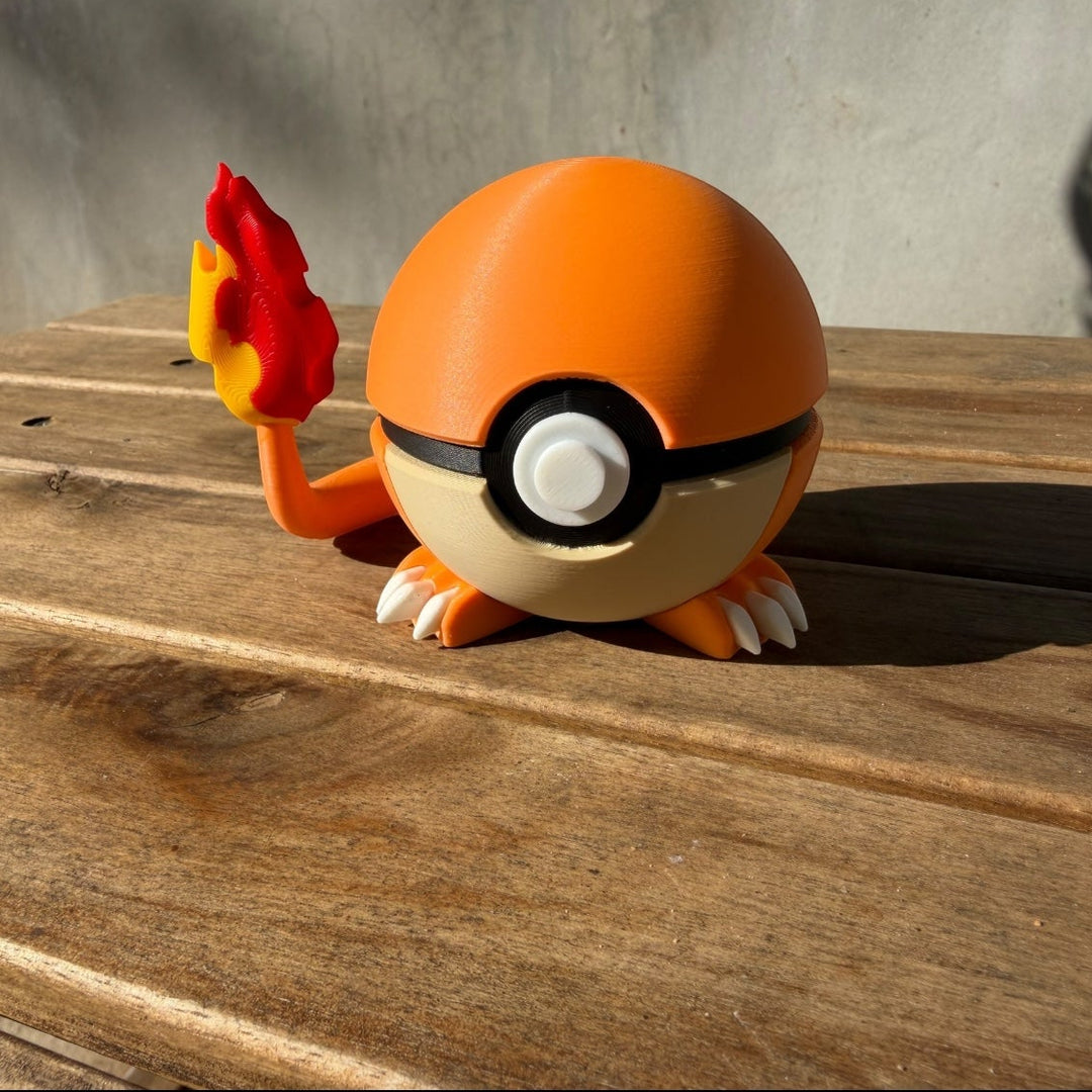 Toy figure of a ball with flame-like design on a wooden surface